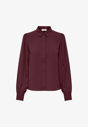 Blusa burgundy de manga larga con cierre de botones, de tela suave, cuello redondeado y puños de manga fruncidos. Superficie texturizada con un ligero brillo.