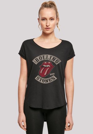 Zwarte katoenen T-shirt met een ronde hals en opgerolde korte mouwen, met een bedrukt rood Rolling Stones-logo.