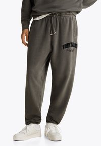 Tommy Jeans RLX VINTAGE VARSITY JOGGER - Tracksuit bottoms - black
