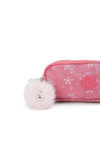Pink fabric pouch with white star pattern, featuring a round, fluffy pink pom-pom zipper pull and a circular logo patch on the side.
