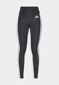 Leggings neri a vita alta, con strisce bianche sui fianchi e un piccolo logo bianco sulla coscia sinistra. Realizzati in materiale liscio ed elasticizzato.