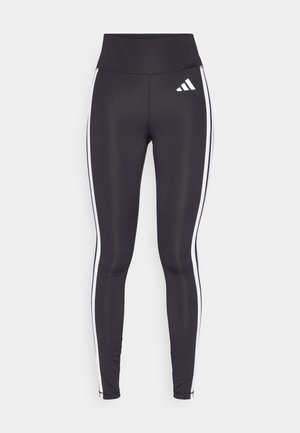 Svart leggings med høy midje, med hvite side striper og en liten hvit logo på øverste venstre lår. Laget av glatt, elastisk materiale.