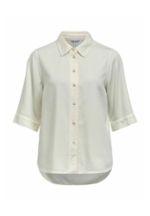 Kreemikas lühikeste varrukatega nööpidega särk terava krae ja ümarate servadega, millel on ees nähtavad seitse nööpi.