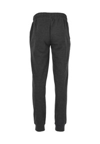 Mörkgrå sweatpants med elastisk midja, avsmalnande benöppningar och mjukt, strukturerat material. Inga fickor synliga på baksidan.