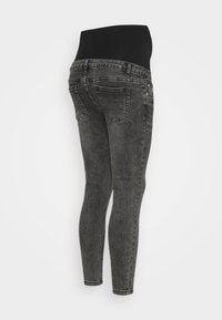 Calças skinny de cintura alta pretas em denim cinza escuro. Possui cinco bolsos, passadores de cinto e uma faixa elástica e suave na cintura para conforto.