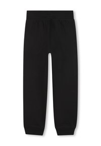 Zwarte joggingbroek van een zachte stof, met een elastische tailleband en taps toelopende benen met strakke manchetten bij de enkels. Soepele textuur, geen patronen.