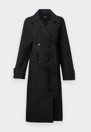 Zwarte trenchcoat van een glad materiaal, met een dubbele rij knopen aan de voorkant, grote revers, een tailleband en omgeslagen mouwen.