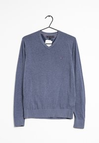 V-neck sweater in heathered navy blue fabric. Features long sleeves, ribbed cuffs and hem, and a small logo accent on the left side.