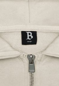 Light gray hoodie with a smooth texture, featuring a silver zipper, fleece lining, and a label marked 'B large' inside the neck area.
