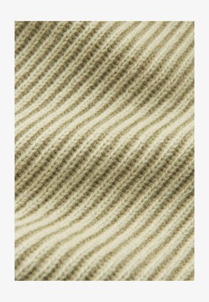 Tessuto lavorato a maglia di un beige chiaro con un motivo a coste ondulato e testurizzato. Materiale morbido, simile alla lana, con filamenti visibili e una sottile variazione di colore.