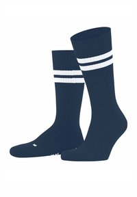 Calze al ginocchio blu navy con due strisce orizzontali bianche vicino alla parte superiore, texture a costine, srotolate e in posizione verticale.