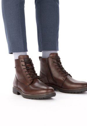 Rieker Bottines à lacets - braun