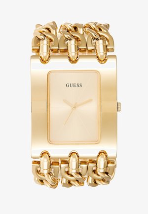 Montre-bracelet Guess ton or avec cadran rectangulaire et bracelet chaîne épais, cadran minimaliste avec trois aiguilles et sans chiffres.