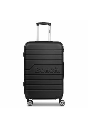 Black hard-shell suitcase with a textured finish, inline spinner wheels, and a retractable aluminum handle. Features the "Bench." logo.