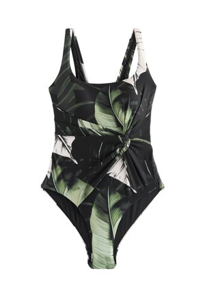 Costum de baie întreg cu model de frunze tropicale verzi și albe pe fundal negru, cu detaliu strâns în zona taliei și bretele duble.