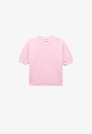 Kurzeilige rosa Strickpullover mit einem strukturierten Muster aus erhabenen, perlartigen Akzenten. Weiches Material und runder Ausschnitt.