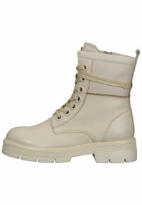Stivale alla caviglia in pelle beige con punta rotonda, suola in gomma rialzata e design con lacci. Presenta una cucitura e un dettaglio avvolgente alla caviglia.