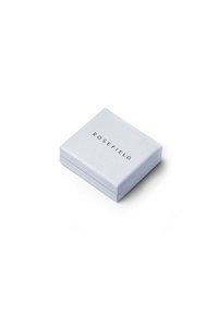 Square jewelry box in matte light blue with embossed "ROSEFIELD" logo in black on top. Smooth surface, minimalistic design, hinged lid.