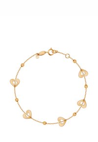 Złota bransoletka z sercowanymi ogniwami z wyciętymi wzorami, przeplatana teksturowanymi kulistymi akcentami; zapinana na haczyk typu lobster.