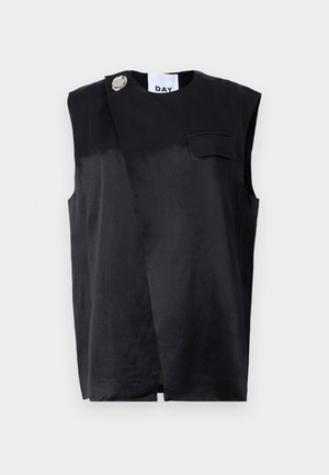 Black sleeveless top with a diagonal design, single chest pocket, and oversized silver button accent. Made of a smooth fabric.