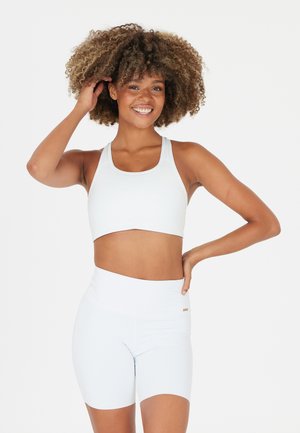 Athlecia, MYOLIE - Reggiseno sportivo con sostegno medio - white
