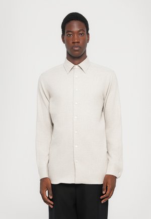 Light gray long-sleeve shirt with a button-down collar, front buttons, and a textured fabric. Simple design, suitable for various occasions.