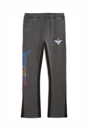 Black and grey sweatpants with side pockets, featuring a blue and red graphic design on one leg and a logo patch on the other.
