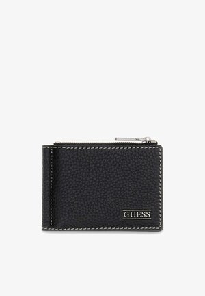 Porte-cartes en cuir noir texturé avec des coutures blanches, une fermeture éclair argentée sur le dessus et le logo GUESS en bas à droite.