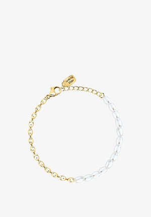 Gold chain bracelet with alternating gold links and white oval pearls, featuring a lobster clasp and a small tag engraved "La Petite Story."