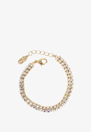 Armbånd i guldfarvet metal med en række klare, iriserende krystaller i klofatning, med lobsterlås og justerbar kæde til lukning.