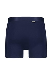 Navyblå boksershorts laget av myk stoff med bred linning, med flatlock-sømmer og en logobadge på venstre front.
