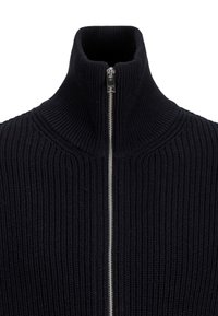 Black knitted sweater with a high collar and a front zipper. Features ribbed texture and a slim fit design.