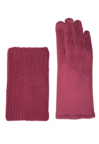 Une paire d'accessoires pour temps froid : un chauffe-poignet en tricot rose doux et un gant rose lisse à doigts complets, tous deux posés à plat.