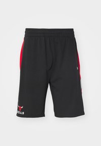 Pantaloni da jogging neri in tessuto, con pannelli laterali rossi, una vita elasticizzata e un logo dei Bulls sulla parte inferiore sinistra.