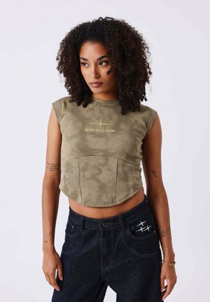 Cropped, olive green sleeveless top with a smooth texture and front panel detailing. Features a printed logo in a lighter shade.