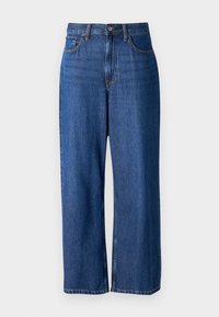 Jean large en denim bleu foncé, avec une taille haute, un design à cinq poches, une fermeture à bouton et des coutures visibles.