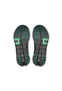 Svarta sportskosulor med en texturerad yta och gröna accenter. Har djupa spår och flexibla spår för bättre grepp och rörelsefrihet.