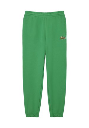 Pantalones deportivos de algodón verdes con cintura y puños elásticos. Presenta un pequeño logo de cocodrilo bordado en el lado izquierdo.