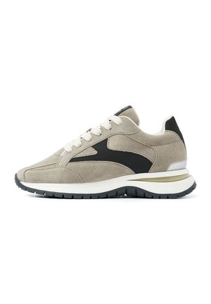 Suede sneakers in light beige with a black mesh side panel. Features white laces and a cushioned white and black sole. Classic athletic design.