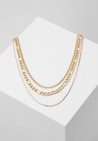 Selecionado, gold-coloured