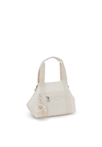 Beige Handtasche mit doppelten Stoffgriffen, Reißverschluss, Fronttasche und einem dekorativen Schlüsselanhänger mit einem flauschigen Charm.