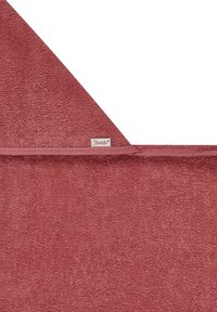Rust-colored bath towel with a textured surface, finished edges, and a small label on one side. Measures approximately 70 x 140 cm.