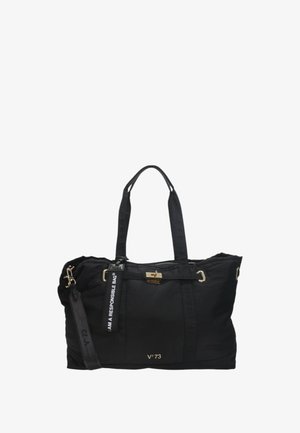 Sac en nylon noir avec quincaillerie dorée, double poignées et une sangle détachable. Présente une étiquette bien en vue indiquant "JE SUIS UN SAC RESPONSABLE."