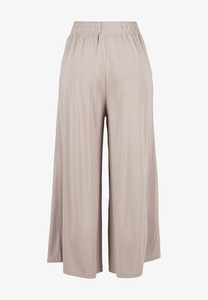 Pantalons culottes beige clair en tissu doux, dotés d'une taille élastique et d'une coupe ample pour le confort et la liberté de mouvement.