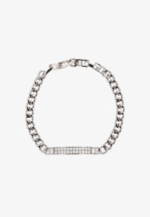 Ezüst lánc karkötő lapos középsőrészével, beágyazott tiszta strasszokkal. Hangsúlyos textúrájú linkek és biztonságos csat kialakítás.