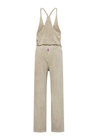 Béžový měkký overal z látky s širokými nohavicemi a střihem na zádech ve stylu racerback. Má malou růžovou štítek s logem poblíž pasu.
