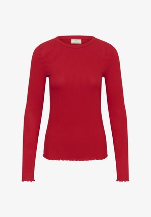 Sarkana ribota garām piedurknēm adīta blūze ar apaļu dekoltē un salātu malas apakšā un piedurkņu galos.