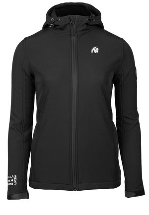 Black softshell jacket with a zip front, adjustable hood, and contrast stitching. Features logo on chest and text detail on sleeve.