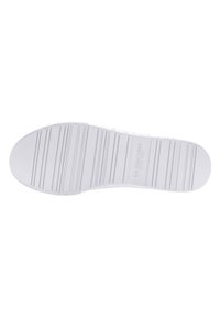 White shoe sole with horizontal grooves and US Polo Assn logo embossed in the center.