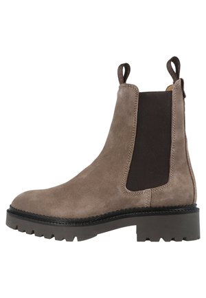 Brown suede Chelsea boot with black elastic side panels, pull tabs on top, and thick black rubber sole with deep treads.
